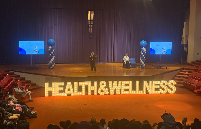  Lit up letters saying Health and Wellness on the DLS auditorium stage